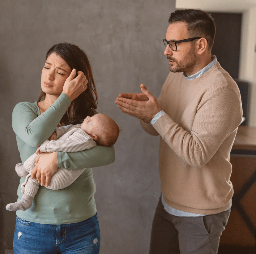 A new mom carrying her new born and having a quarrel with her partner