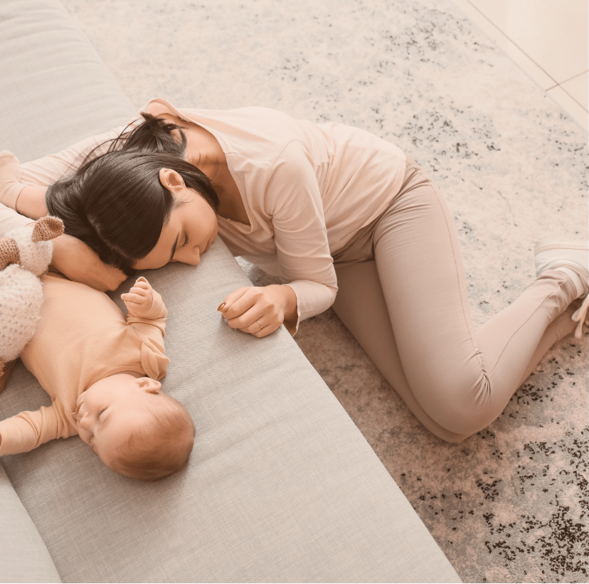 A sleeping mom and newborn