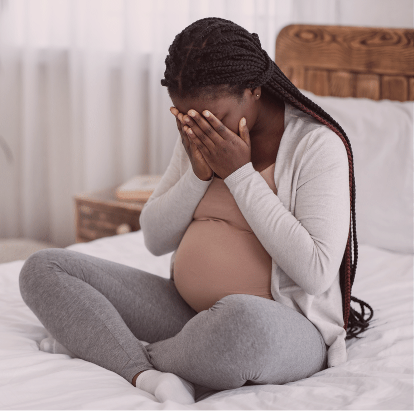 An overwhelmed pregnant woman