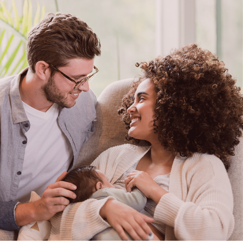 A happy mother with her new born and partner