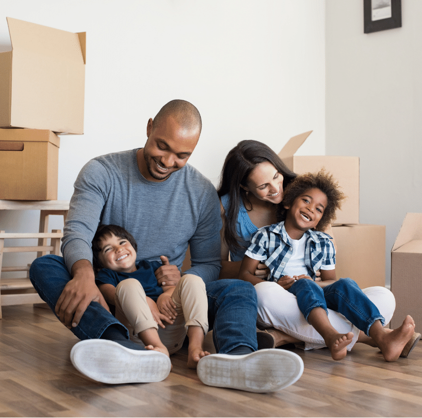 A family photo of a Happy wife and hisband with two smiling kids