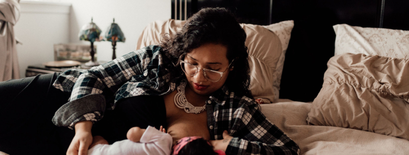 mother breastfeeding baby to sleep